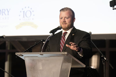 Jared speaking at a podium