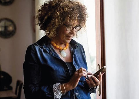 woman scrolling cell phone
