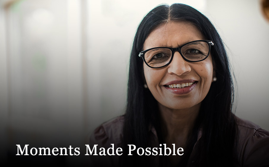 woman with large glasses smiling