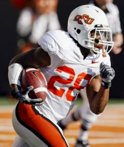 Michael Roberts running ball in football game