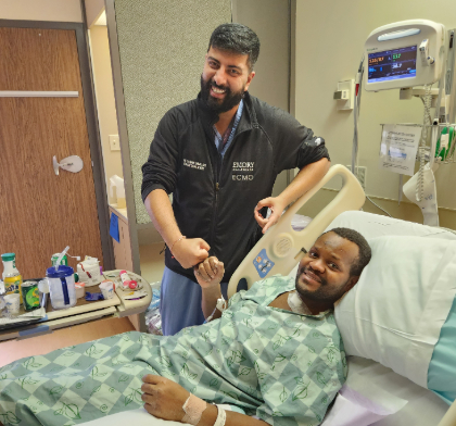 Sagar Dave gives Roberts a fist bump