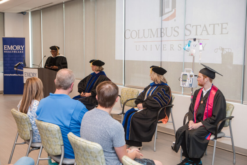 guests at Martin's graduation listen to a speech