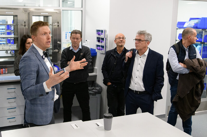 Ryan Haumschild with members of the delegation in the specialty pharmacy space of Winship at Emory Midtown