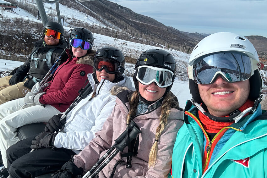 Emory heart transplant patient with family on a ski lift about a year post-operation