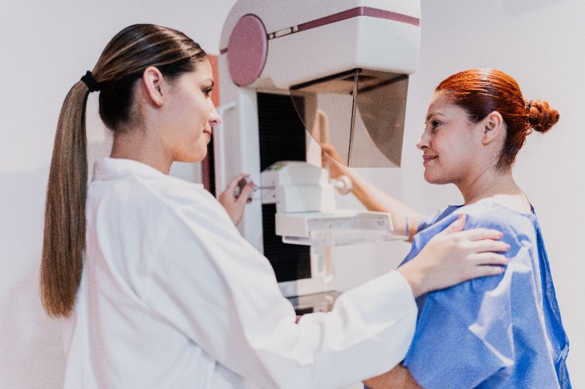 woman receiving mammogram