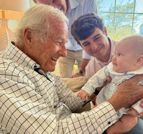 man holding baby