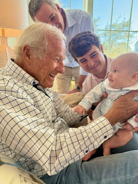 man holding baby