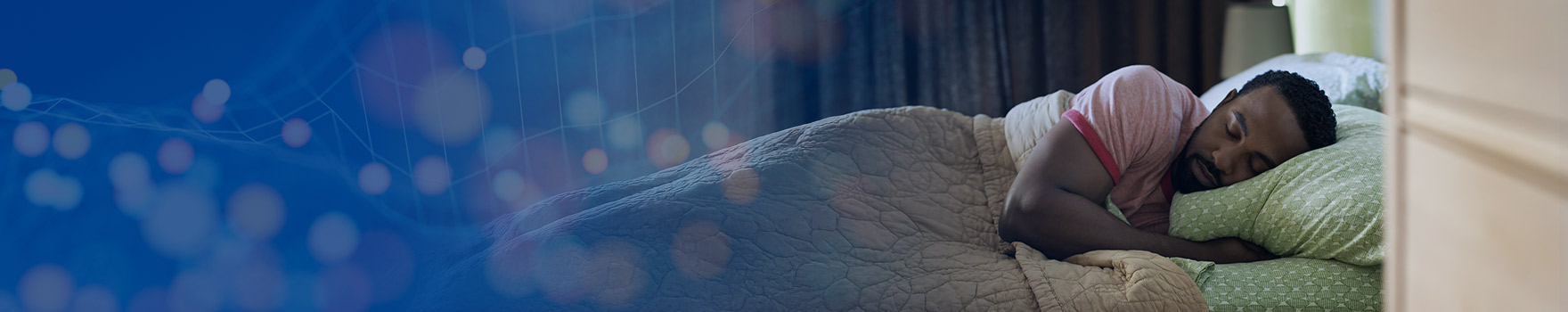 Resting soundly, the man sleeps with ease, cradled by his pillow.