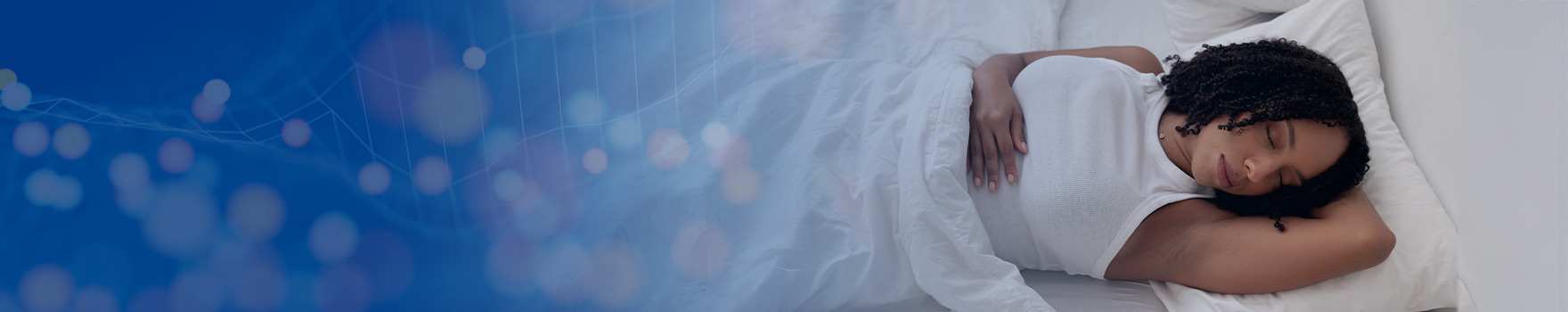 Comfortable and relaxed, she sleeps with her head resting on a pillow.