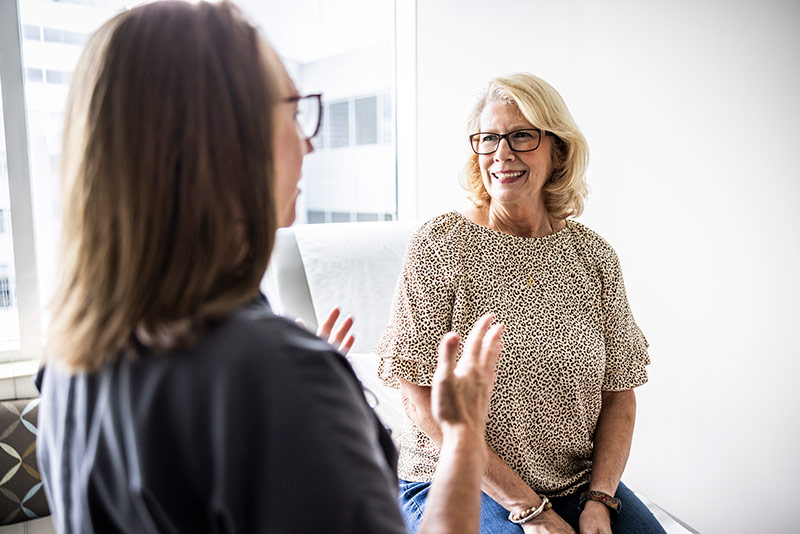 Two women talking together