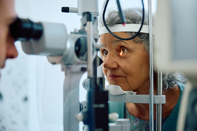 patient getting eye scanned by ophthalmologist