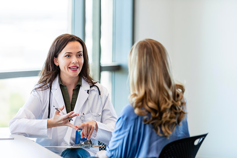 Doctor and patient seated in ophthalmology consultation room