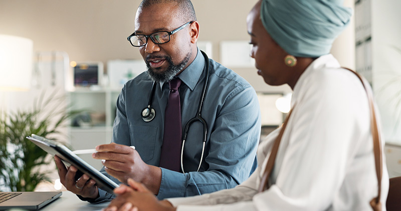 Doctor and patient having a conversation in eye clinic interior