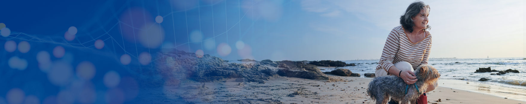 woman with her dog at the beach