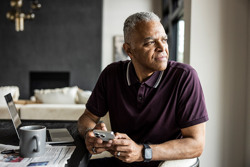 man looking out the window