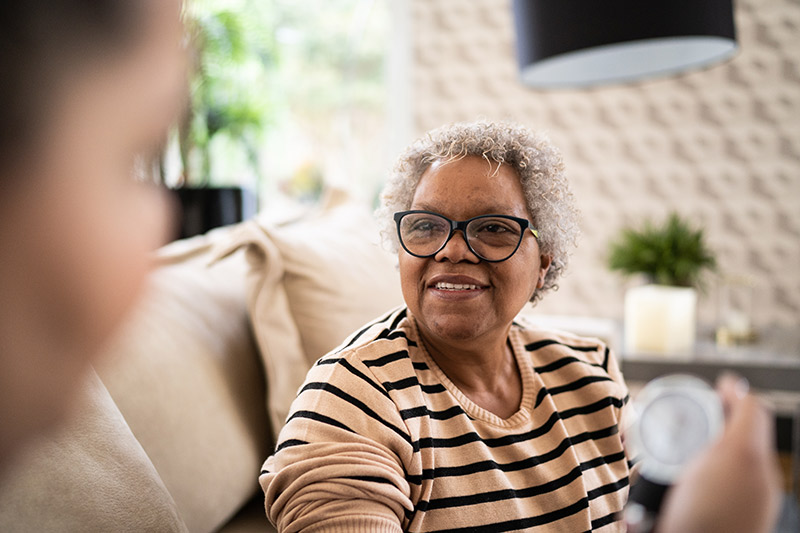 woman getting blood pressure checked