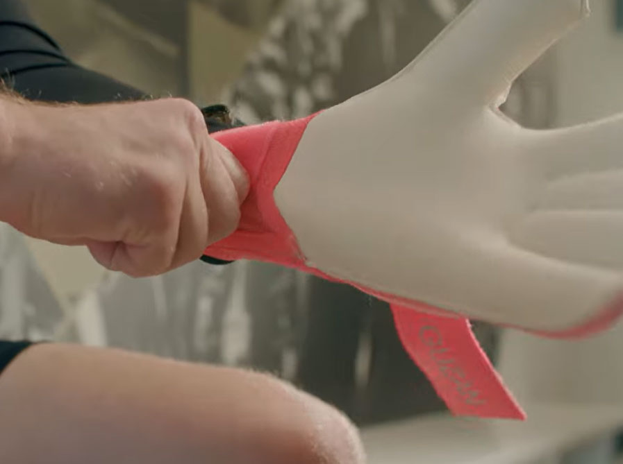 Brad Guzman putting on a glove