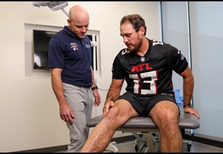 Emory Sports Medicine Physician with Atlanta Falcons Player