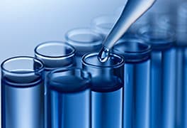Dropping liquid into beakers